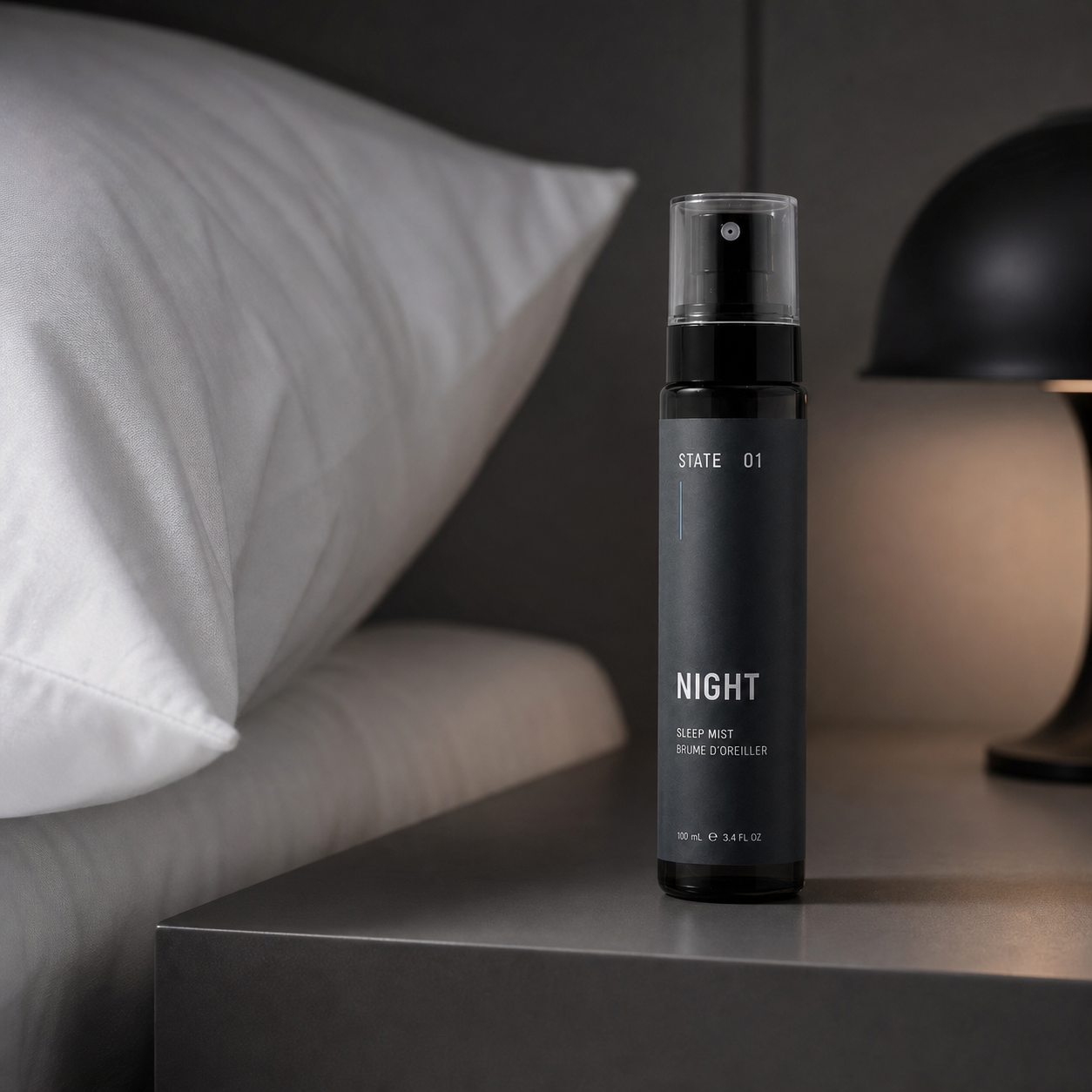 STATE 01 NIGHT beside a white pillow